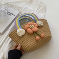 Handmade woven straw bag featuring a rainbow handle and 3D fabric flower detail - Dark Khaki