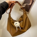 Caramel pebble leather Hobo bag with wide strap and white plush monster charm - Brown with Pendant