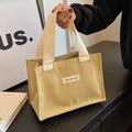 Mosterdgroene canvas draagtas met modelabel en gebroken witte katoenen handvatten - Khaki