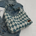 Blue and white argyle canvas shoulder bag with a brown leather fashion tag - Blue