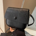 Retro black oil wax leather crossbody bag with flap and round decorative button - Black
