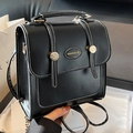 Vintage black faux leather British style backpack with white stitching and metal buckle - Black without Pendant
