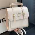 Mini mochila de cuero PU texturizado blanco crema con herrajes dorados y asa superior - Blanco Roto Sin Colgante