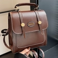 Dark brown retro faux leather backpack with white stitching and metal button details - Coffee No Charm
