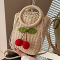 Handcrafted straw handbag with round handle and cherry decor for vacation style - Off White