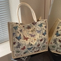 Large woven tote bag with colorful butterfly embroidery and cream canvas handles - Off White