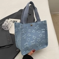 Light blue canvas tote bag with 3D floral embroidery and gold snap button closure - Small Blue