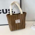 Brown corduroy tote bag with vertical stripes and cream handles for daily casual use - Brown