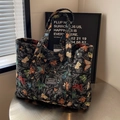 Grande borsa shopper in tessuto jacquard nero con farfalle colorate e etichetta retrò - Nero