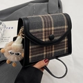 Retro grey tartan flap crossbody bag with leather trim and brown plush monster charm - Black With Khaki Elf Pendant