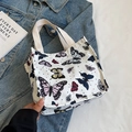 Mini canvas shopper met kleurrijke vlinderprint en beige geweven handvatten - Regenboog Klein