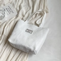 White tote bag featuring textured heart jacquard and durable woven handles for women - Small / Off White