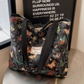 Black canvas tote bag featuring colorful butterfly patterns and a woven shoulder strap - Large Black (With Lining With Zipper No Inner Pocket)