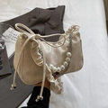 Creamy pleated crescent bag with pearl and chain handle in high-gloss synthetic leather - White