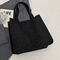 Grande borsa tote nera con trama jacquard floreale e manici intrecciati per il lavoro - L Nero