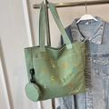 Light green canvas tote bag with colorful embroidery and matching round coin purse - Green