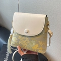 Elegant beige jacquard bucket bag with landscape pattern and white tassel detail - Beige With Chinese Style Tassel