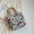 Cream canvas tote bag featuring colorful floral embroidery and stylish woven handles - Small / Burgundy