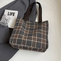 Brown checkered canvas tote bag with woven handles shown in a lifestyle scene - Large / No Pendant / Black