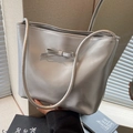 Silver metallic shoulder bag for women with a decorative bow and slim straps - Silver