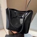 Glossy black patent leather tote bag with a matching bow detail and long thin handles - Black