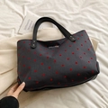 Bolso tote de lona gris oscuro con lunares rojos y detalle de lazo metálico - Lunares