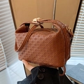Brown woven texture handbag with golden metal clasp and crossbody strap in PU leather - Brown
