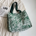 Large canvas tote bag featuring green butterfly jacquard patterns on cream fabric - L Green