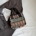 Ethnic pattern woven tote bag with orange and green tones on a brown blazer background - Small / Brown