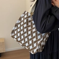 Brown and white geometric pattern tote bag with thick beige canvas straps on a model - Large (No Charm) / Coffee