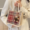 Fashionable plaid linen tote bag for women featuring a cute monster plush charm - Red Zipper Style With Brown Elf Charm