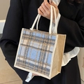 Minimalist linen tote bag featuring a blue and brown plaid pattern and rope handles - Blue Zipper Style