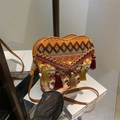 Ethnic heart-shaped woven crossbody bag with colorful tassels and geometric patterns - Orange