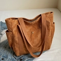Caramel brown corduroy tote bag with side pockets and thick webbed handles for daily use - Brown
