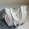 Large beige corduroy tote bag with multiple pockets and long woven handles for women - White