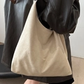 Minimalist beige suede hobo tote bag with a spacious silhouette for daily commute - Off White