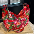 Large hobo shoulder bag featuring red traditional Chinese floral and phoenix patterns - Red