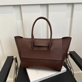 Minimalist large dark brown leather tote bag with round handles and spacious interior - Brown
