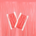Detail of pink flat elastic ribbons on white plastic spools for party decorations - Fluorescent Pink Tinsel Curtain