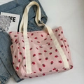 Borsa tote in velluto a coste rosa con motivo a fragole e manici in tela bianco panna - Rosa