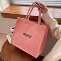 Borsa tote in tela rosa con stampa merci nera e manici intrecciati per l'uso quotidiano - Rosa