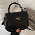 Fashionable black matte faux leather saddle bag with gold lettering and top handle - Black