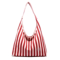 Large red and white striped canvas tote bag with spacious interior for daily travel - Red