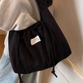 Black corduroy shoulder bag for women with drawstring design and spacious interior - Black