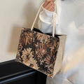 Black floral jacquard tote bag with golden embroidery and white woven rope handles - Black Rope Style