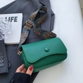 Green lychee leather crossbody bag with a geometric pattern wide strap and gold hardware - Green
