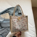 Beige canvas tote bag with white floral lace, wooden button, and woven rope handles - Red Flower