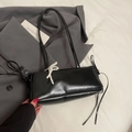 Glossy black underarm bag with elegant pearl bow charm and minimalist sleek finish - Black + Pearl Bow Charm