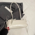 Creamy white leather underarm bag with decorative pearl bow and long strap details - White + Pearl Bow Charm
