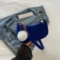 Royal blue crescent shoulder bag with V-quilted velvet finish and furry pompom charm - Blue With White Pom Pom